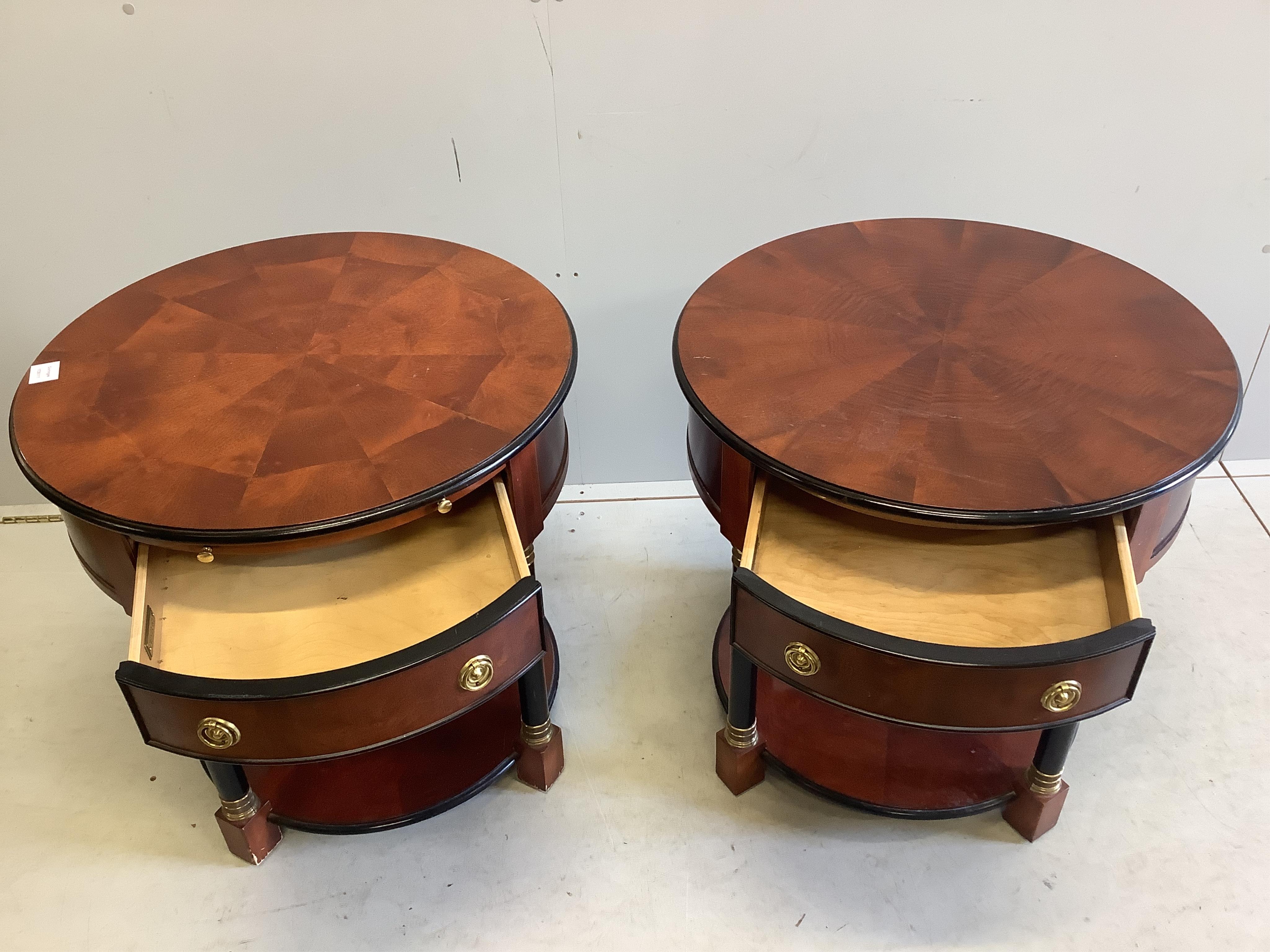 A pair of French Empire style mahogany and ebonised two tier circular tables, diameter 65cm, height 54cm. Condition - fair